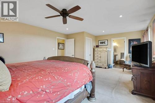 Carpeted bedroom featuring recessed lighting, ceiling fan, and connected bathroom - 5511 Second Line, Erin, ON - Indoor Photo Showing Bedroom