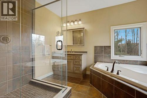 Bathroom featuring vanity, a stall shower, a bath, and dark tile patterned floors - 5511 Second Line, Erin, ON - Indoor Photo Showing Bathroom