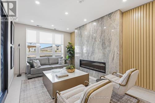 310 - 1560 Upper West Avenue, London South (South B), ON - Indoor Photo Showing Living Room With Fireplace