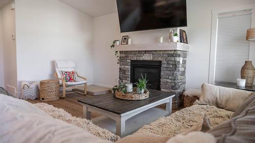 107 18Th Street, Cranbrook, BC - Indoor Photo Showing Living Room With Fireplace