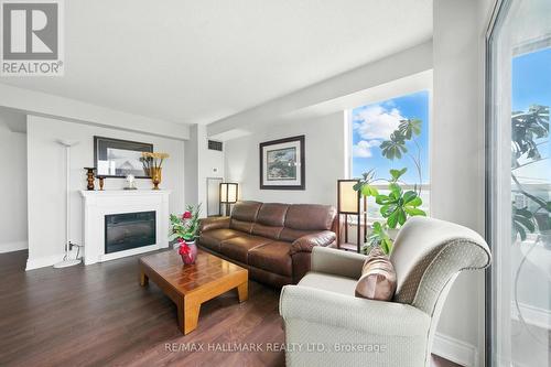 2002 - 215 Wynford Drive, Toronto, ON - Indoor Photo Showing Living Room With Fireplace
