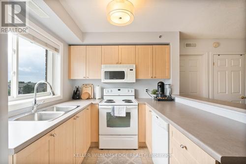 304 - 4450 Fairview Street, Burlington, ON - Indoor Photo Showing Kitchen With Double Sink