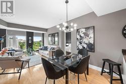 Leads into the elegant dining space w/ chandelier. - 