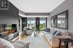 Electric fireplace & walkout to balcony. - 