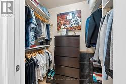 Walkin closet w custom shelving & room for dresser - 