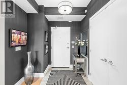 Unit 1006 welcoming entry way w/ tiled flooring. - 