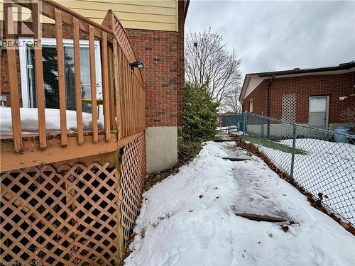 Snow covered property featuring brick siding - 86 Devonglen Drive, Kitchener, ON - Outdoor With Exterior