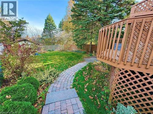 Fenced backyard with a wooden deck - 86 Devonglen Drive, Kitchener, ON - Outdoor