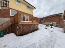 Snow covered back of property featuring a wooden deck and brick siding - 86 Devonglen Drive, Kitchener, ON  - Outdoor With Deck Patio Veranda With Exterior 