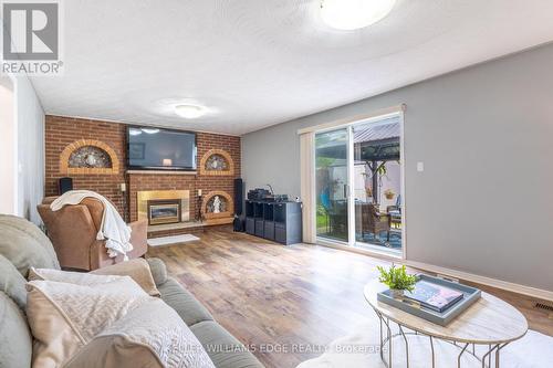 63 Lionsgate Avenue, Hamilton, ON - Indoor Photo Showing Living Room With Fireplace