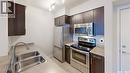 2115 5500 Mitchinson Way, Regina, SK  - Indoor Photo Showing Kitchen With Stainless Steel Kitchen With Double Sink 