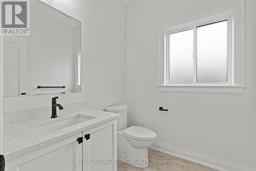 Main floor 2pc bath. Quartz counters. - 4705 Lee Avenue, Niagara Falls (Ascot), ON - Indoor Photo Showing Bathroom