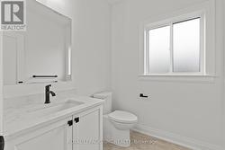 Main floor 2pc bath. Quartz counters. - 