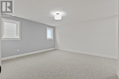 King size Primary Suite. - 4705 Lee Avenue, Niagara Falls (Ascot), ON - Indoor Photo Showing Other Room