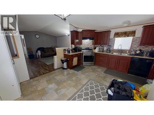 8125 85A Avenue, Fort St. John, BC - Indoor Photo Showing Kitchen With Double Sink