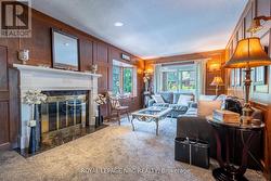 Family room overlooking the pool area features... - 