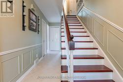 Hallway to kitchen and stairs to sleeping area - 