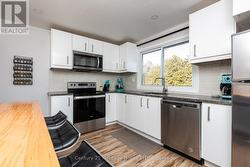 Kitchen - Granite Tops, Laminate Floors - 