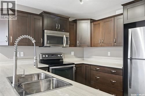 242 Kloppenburg Way, Saskatoon, SK - Indoor Photo Showing Kitchen With Double Sink With Upgraded Kitchen