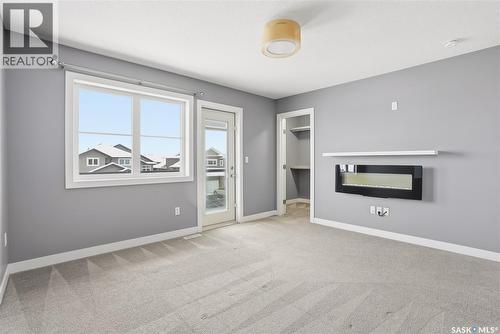 242 Kloppenburg Way, Saskatoon, SK - Indoor With Fireplace