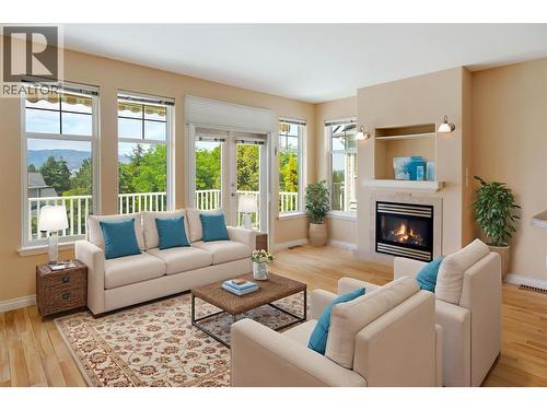 *This photo has been virtually staged. - 371 Mccarren Avenue, Kelowna, BC - Indoor Photo Showing Living Room With Fireplace