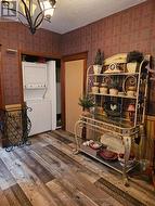 Stacked washer/dryer in entry area - 