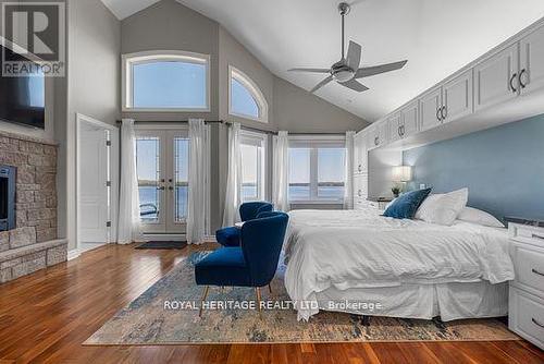34 Hills Road, Kawartha Lakes (Bobcaygeon), ON - Indoor Photo Showing Bedroom With Fireplace