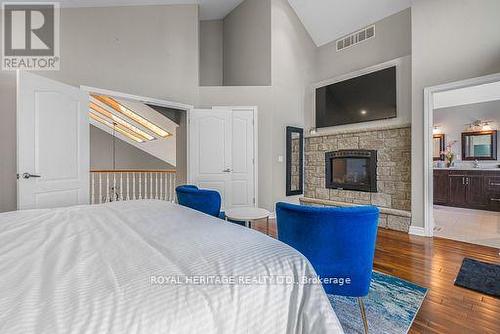34 Hills Road, Kawartha Lakes (Bobcaygeon), ON - Indoor Photo Showing Bedroom With Fireplace