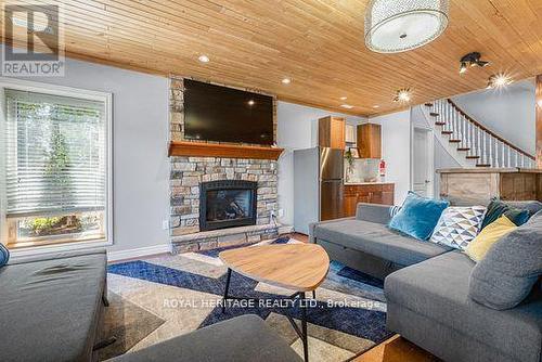 34 Hills Road, Kawartha Lakes (Bobcaygeon), ON - Indoor Photo Showing Living Room With Fireplace