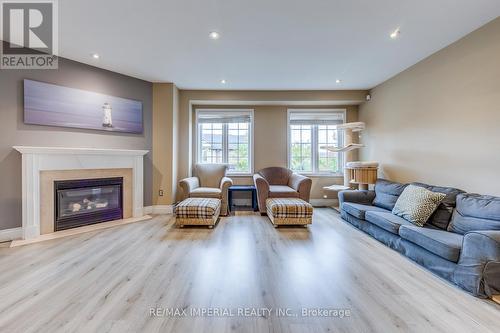 25 - 7 Southside Place, Hamilton, ON - Indoor Photo Showing Living Room With Fireplace