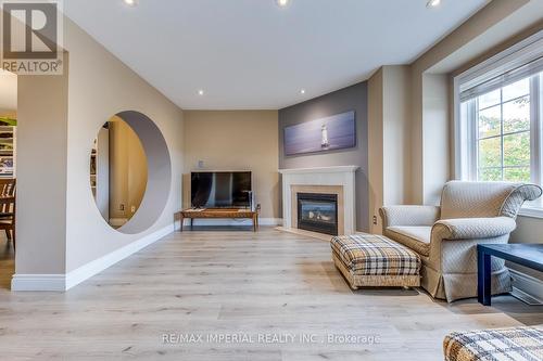 25 - 7 Southside Place, Hamilton, ON - Indoor Photo Showing Living Room With Fireplace