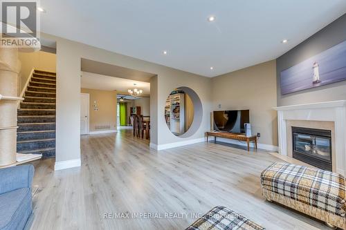 25 - 7 Southside Place, Hamilton, ON - Indoor Photo Showing Living Room With Fireplace