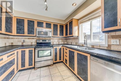 25 - 7 Southside Place, Hamilton, ON - Indoor Photo Showing Kitchen With Double Sink