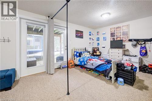 Bedroom with a textured ceiling and carpet - 34 Harrison Street, Stratford, ON - Indoor Photo Showing Bedroom