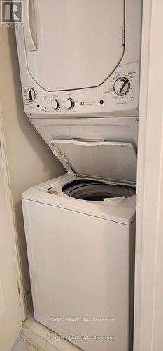 Stacked Washer & Dryer - 314 - 1630 Queen Street E, Toronto, ON - Indoor Photo Showing Laundry Room