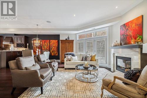 Garden Door Walk-Out to Living Room Balcony - 3 - 120 Bronte Road, Oakville (Br Bronte), ON - Indoor Photo Showing Living Room With Fireplace