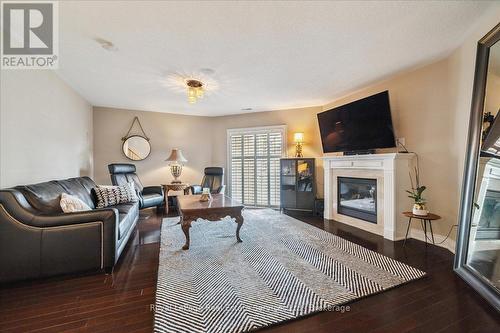 Family Room with Walk-Out to Back Yard - 3 - 120 Bronte Road, Oakville (Br Bronte), ON - Indoor Photo Showing Living Room With Fireplace