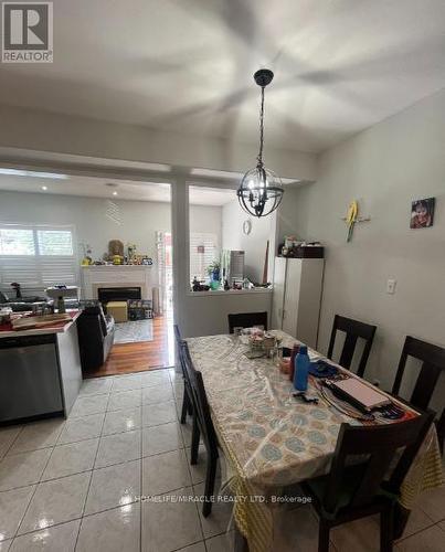 6912 Buttle Station Place, Mississauga, ON - Indoor Photo Showing Dining Room With Fireplace
