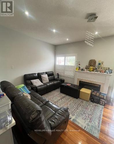 6912 Buttle Station Place, Mississauga, ON - Indoor Photo Showing Living Room With Fireplace