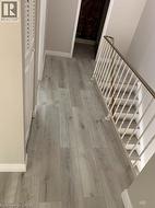 Hallway with light wood-style floors - 