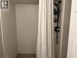 Bathroom with a stall shower - 