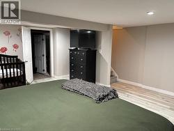 Bedroom with baseboards and light wood-style flooring - 