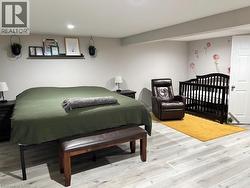 Bedroom featuring light wood-type flooring and recessed lighting - 