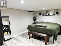 Bedroom featuring light wood-style floors and recessed lighting - 