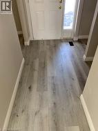 Entryway featuring baseboards and light wood-style flooring - 