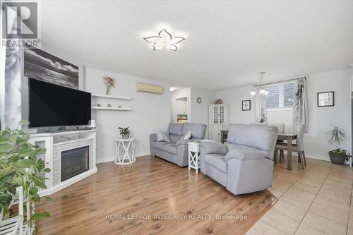 1 - 46 Cambridge Street, The Nation, ON - Indoor Photo Showing Living Room With Fireplace