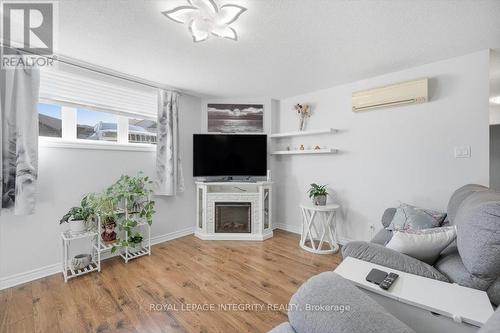 1 - 46 Cambridge Street, The Nation, ON - Indoor Photo Showing Living Room With Fireplace