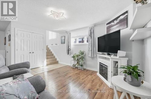 1 - 46 Cambridge Street, The Nation, ON - Indoor Photo Showing Living Room With Fireplace