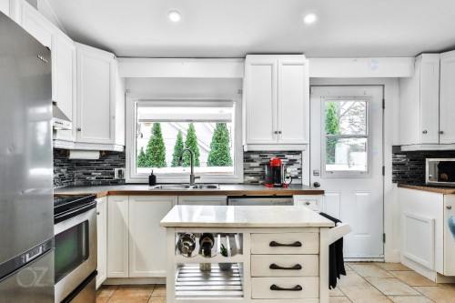 Cuisine - 25 Ch. De L'Île-De-Mai, Boisbriand, QC - Indoor Photo Showing Kitchen With Double Sink