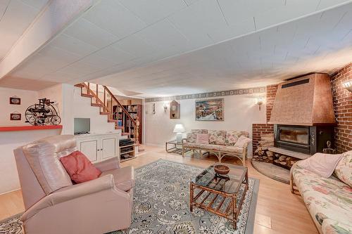 Salle familiale - 795 Place Valiquette, Brossard, QC - Indoor Photo Showing Living Room With Fireplace